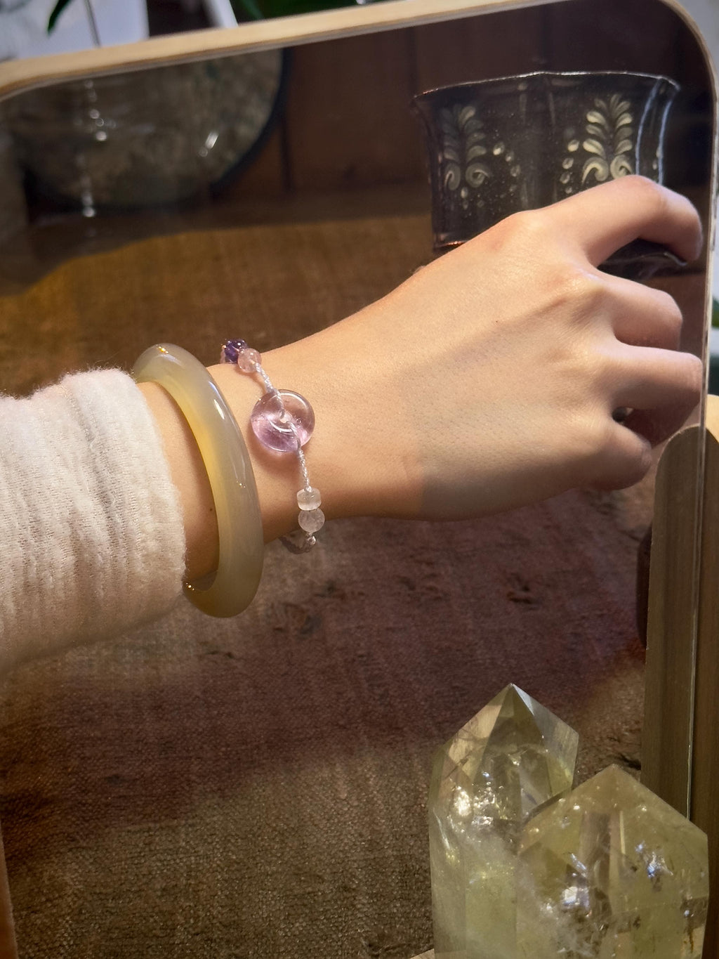 Handwoven amethyst and rose quartz bracelet detail