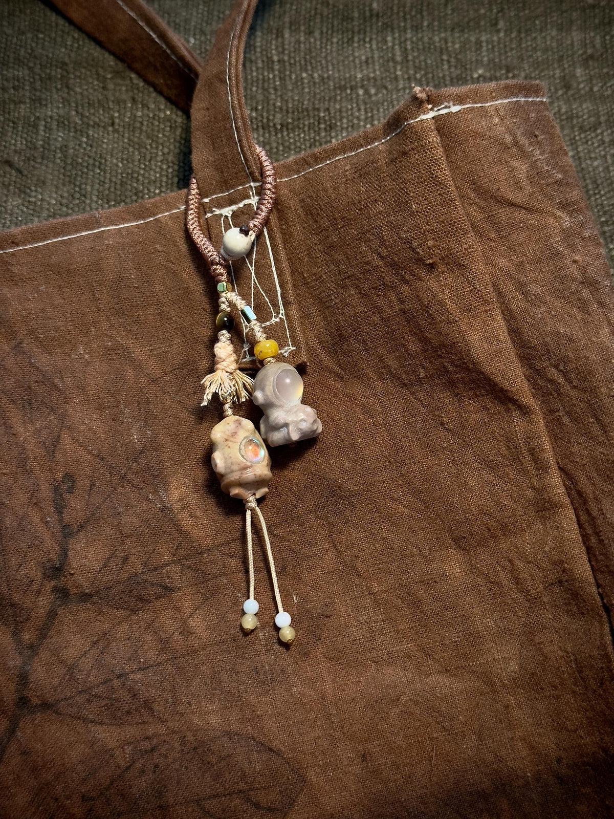 Astronaut natural stone handwoven bag charm detail