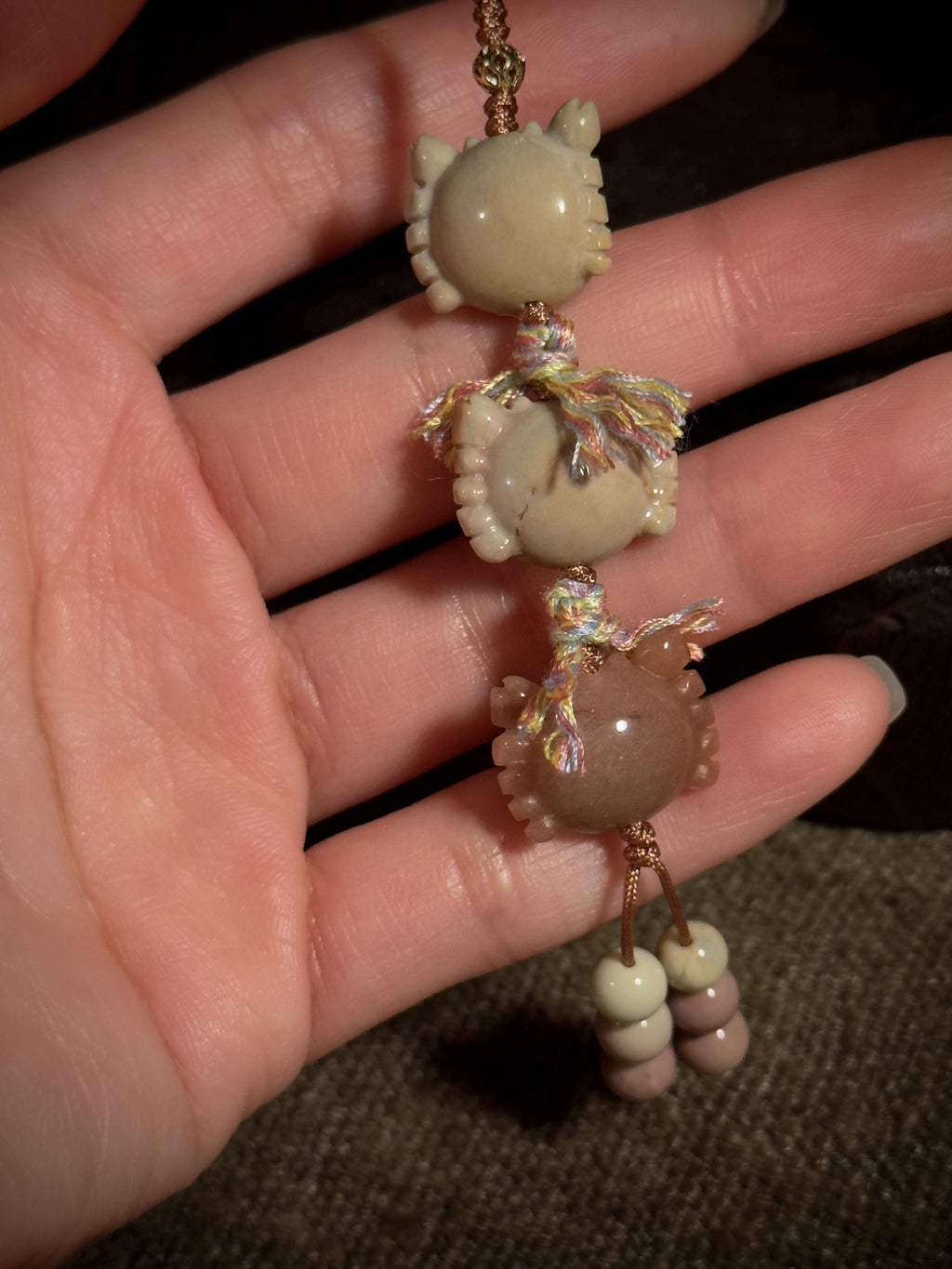 Three crab coin natural stone bag charm close-up