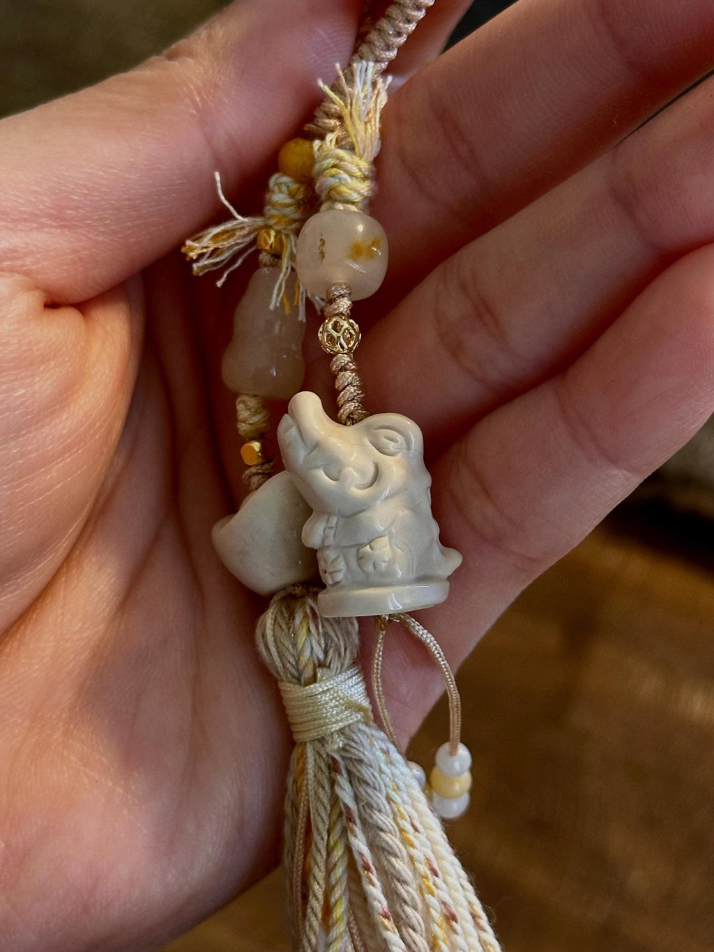 Carved crocodile natural stone charm close-up