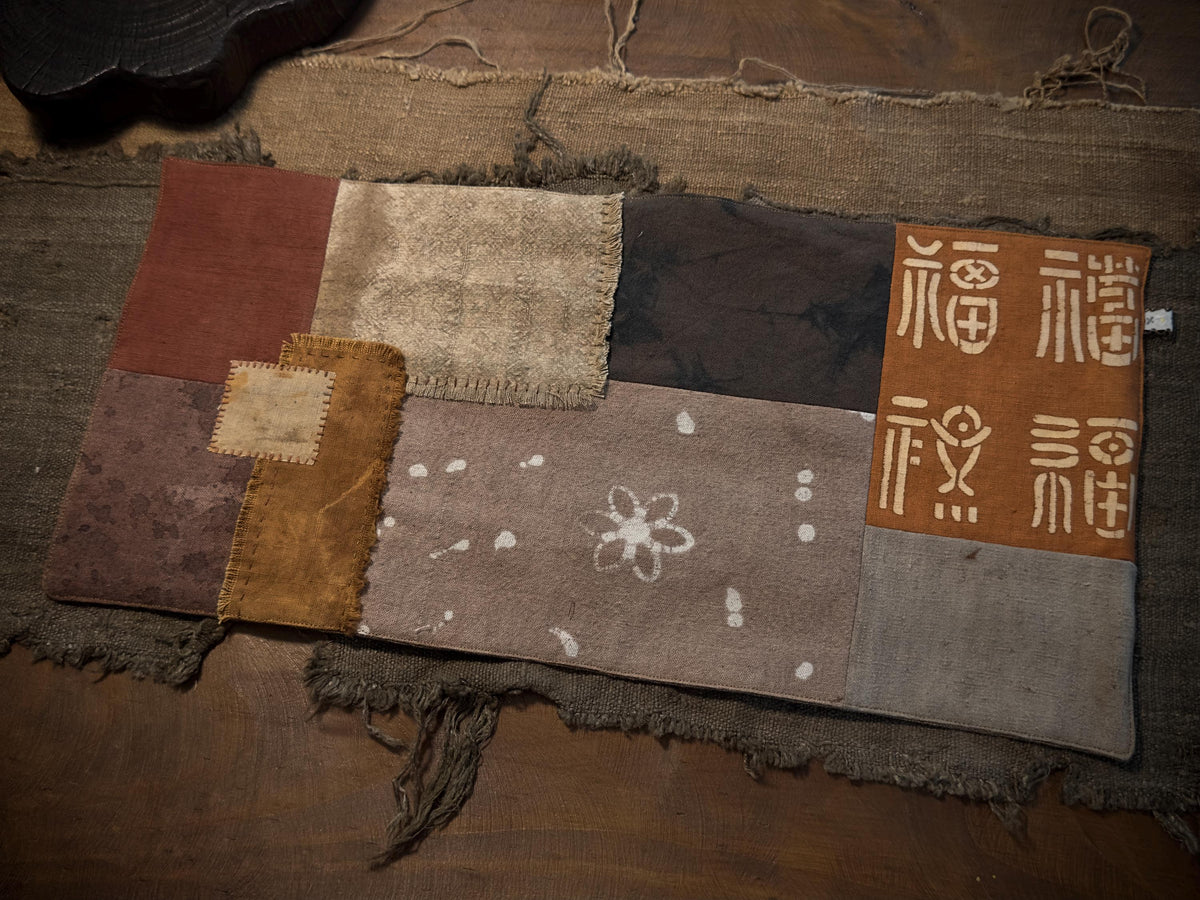 Wabi-sabi tea cloth in earthy plant-dyed tones