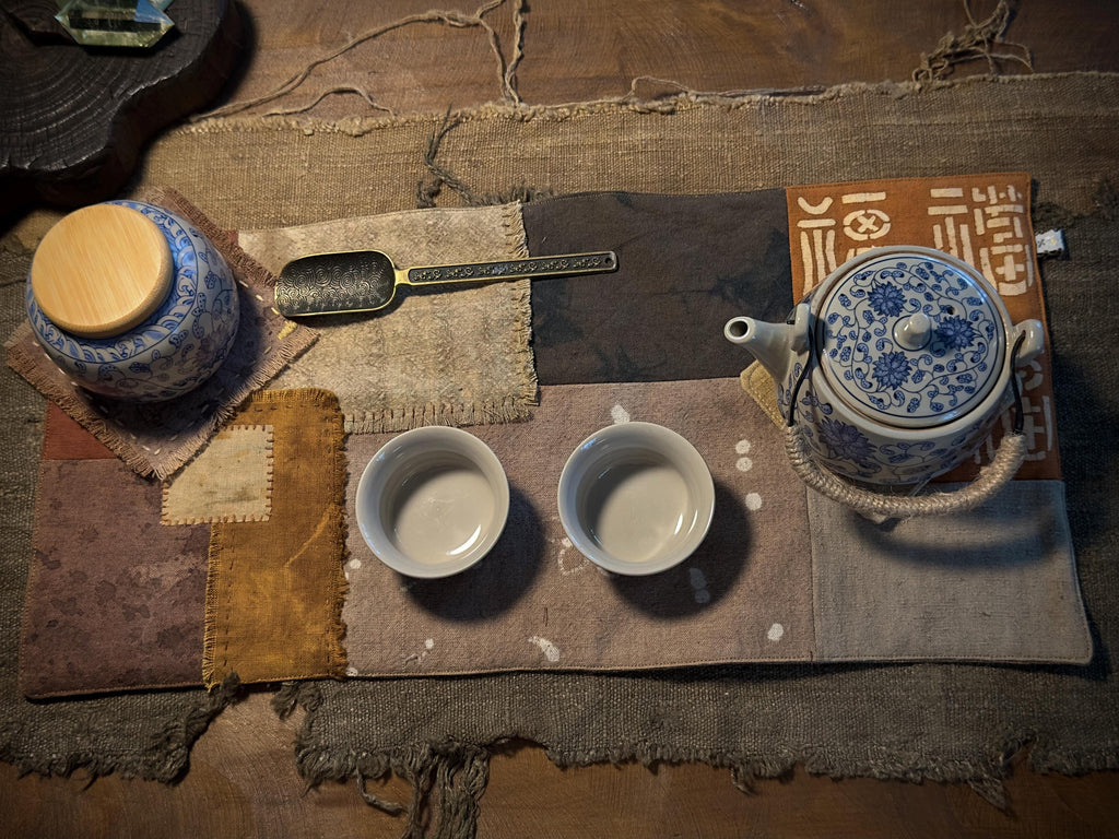 Plant-dyed tea mat with frayed hand-finished edges