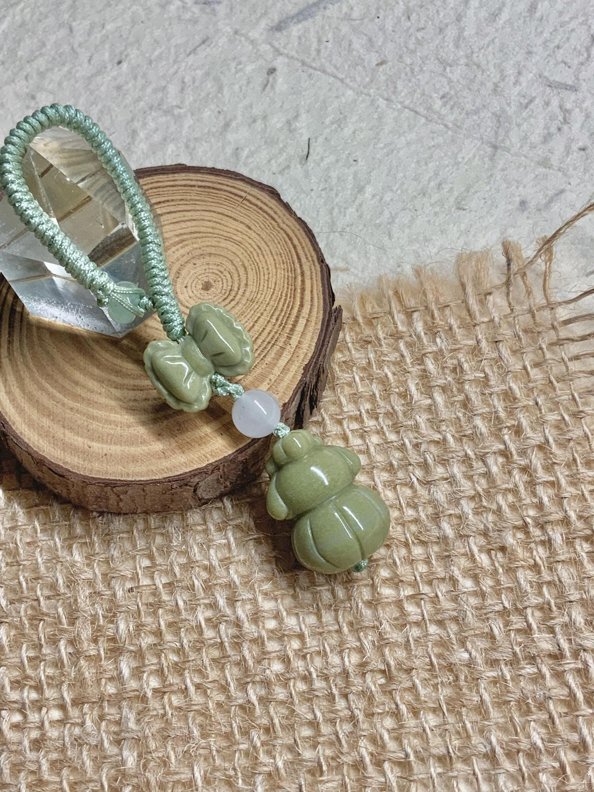 Handwoven green bunny natural stone pendant