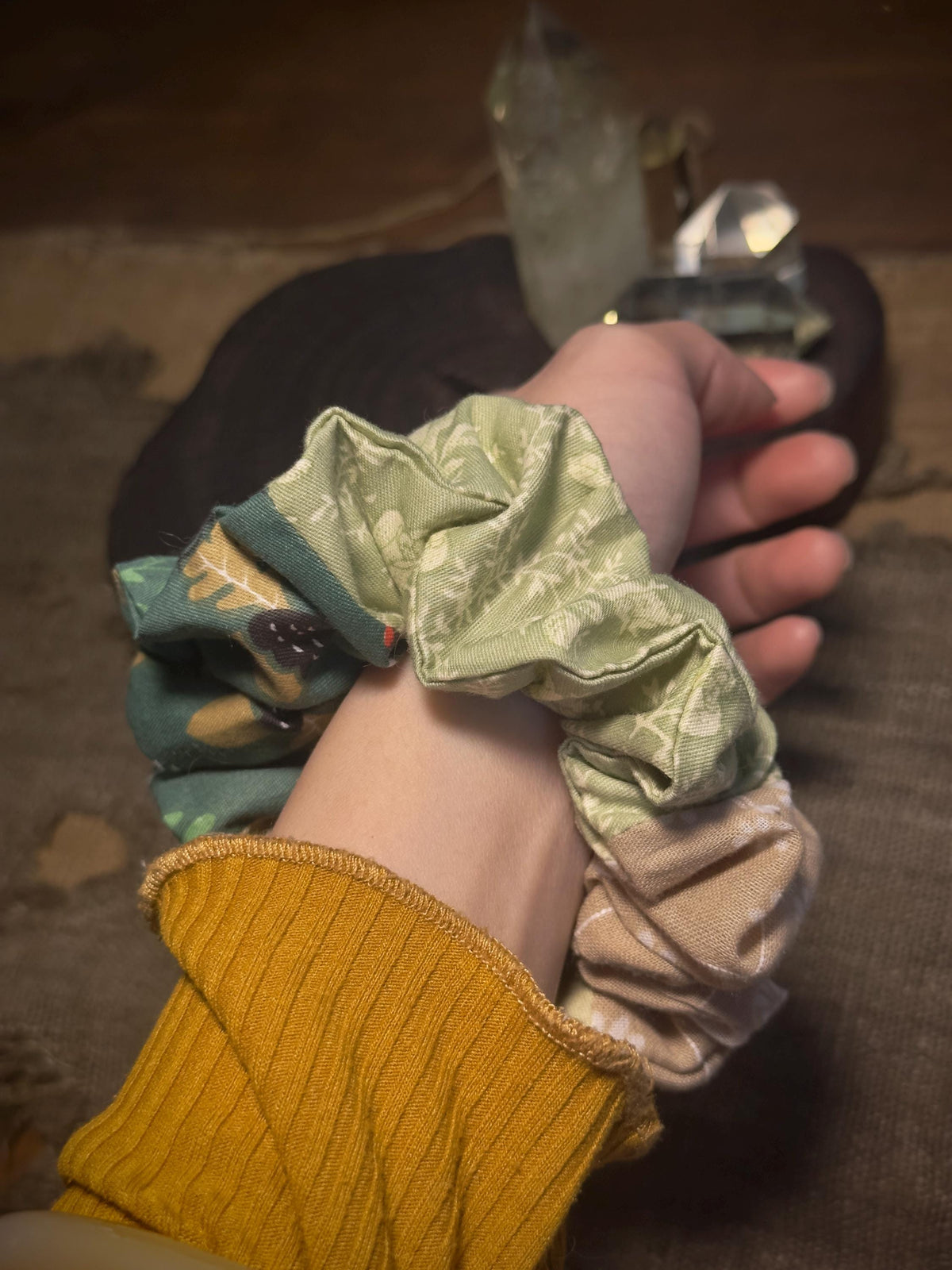 Structured cotton gathers on green patchwork scrunchie