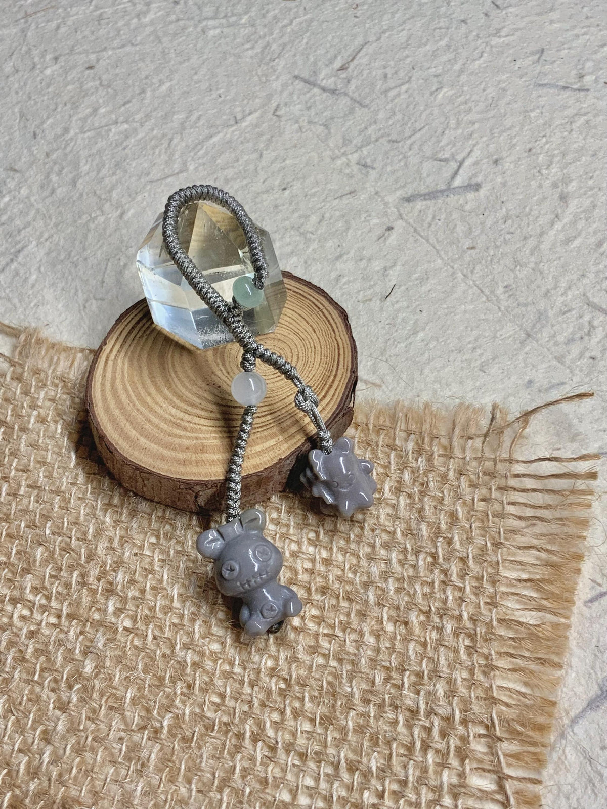 Natural Alashan agate grey doll charm detail