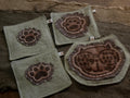 Wabi-Sabi plant-dyed cat paw and botanical coasters – set of 4