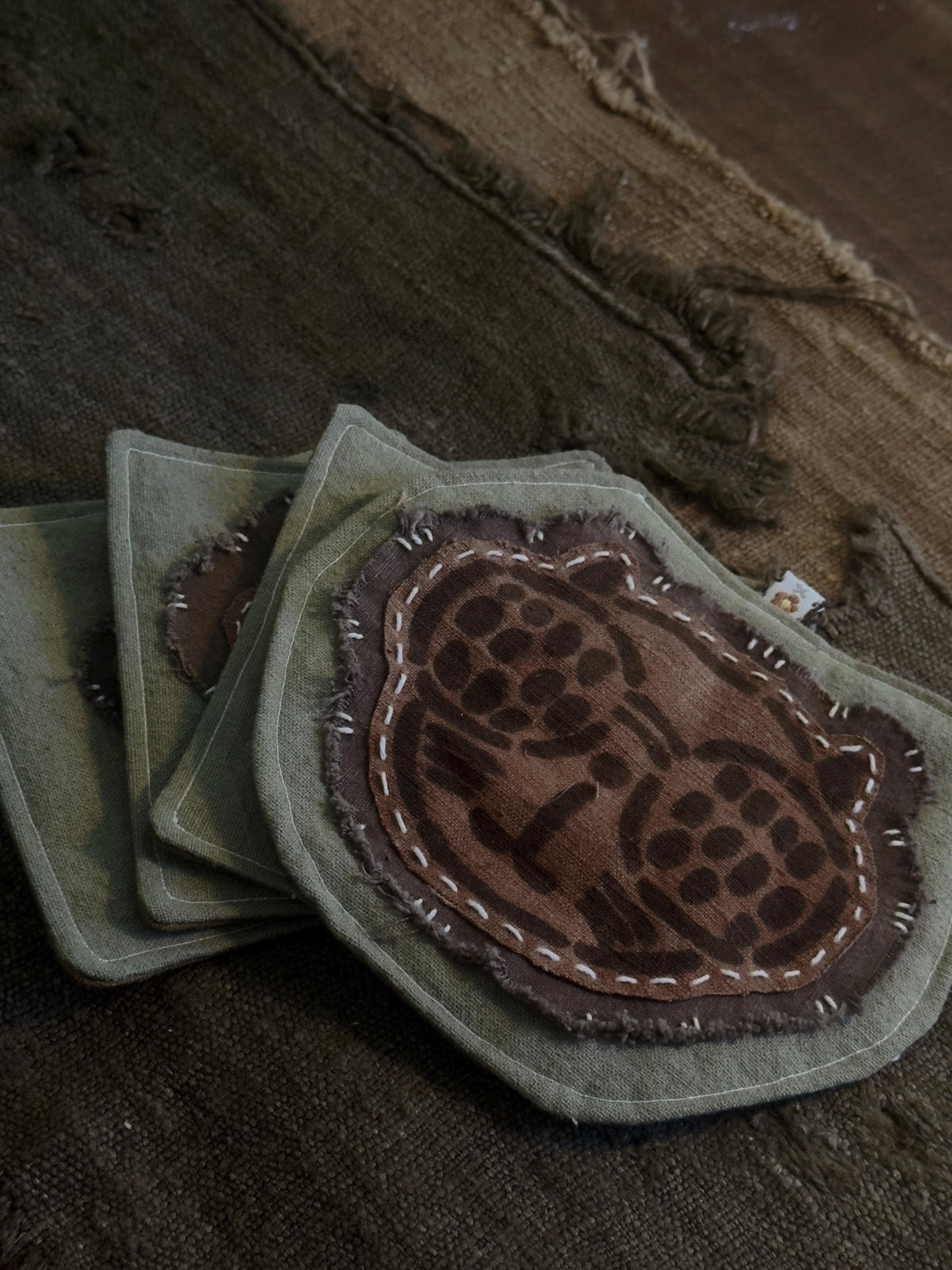 Plant-dyed cotton cat paw and botanical coaster – detail 7