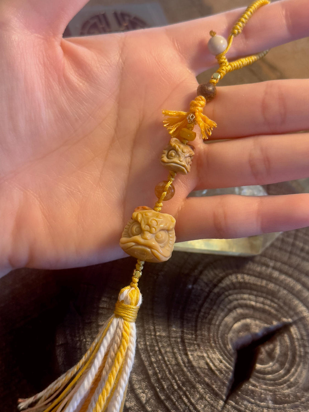 Handwoven lion dance Alashan agate bag charm detail