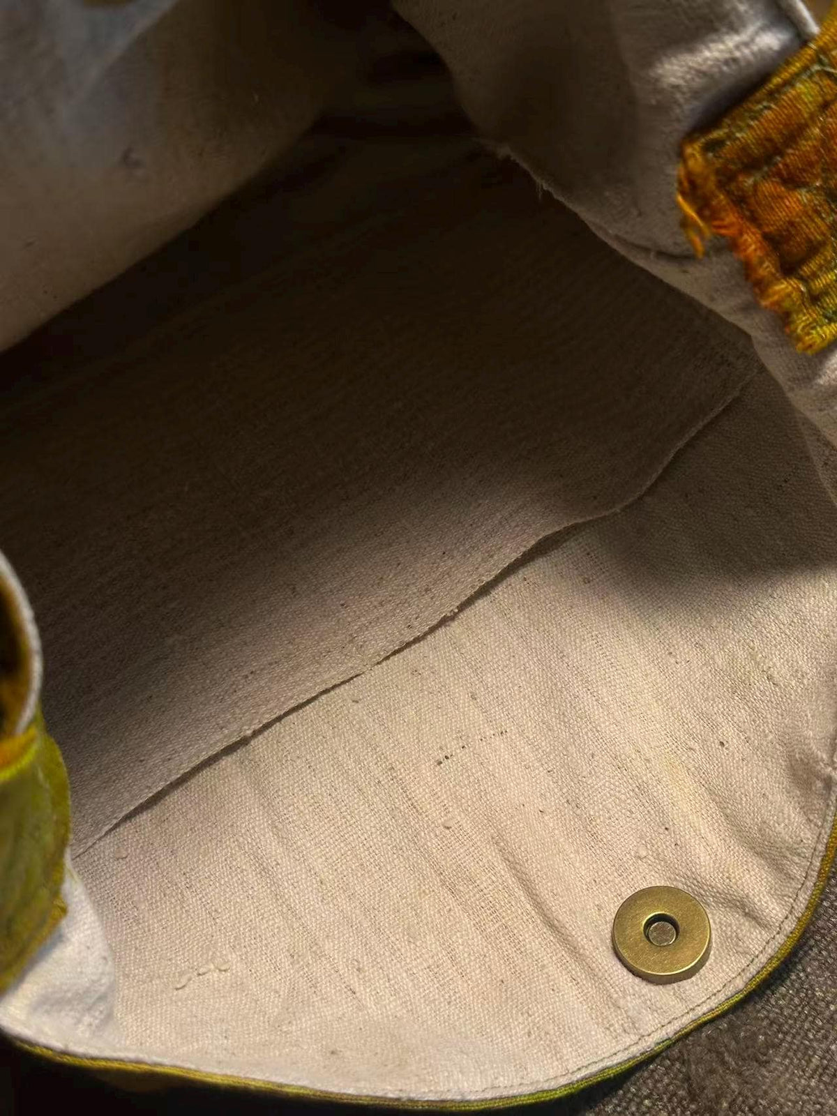 Natural plant dyed cotton shoulder bag in earthy orange olive and green tones