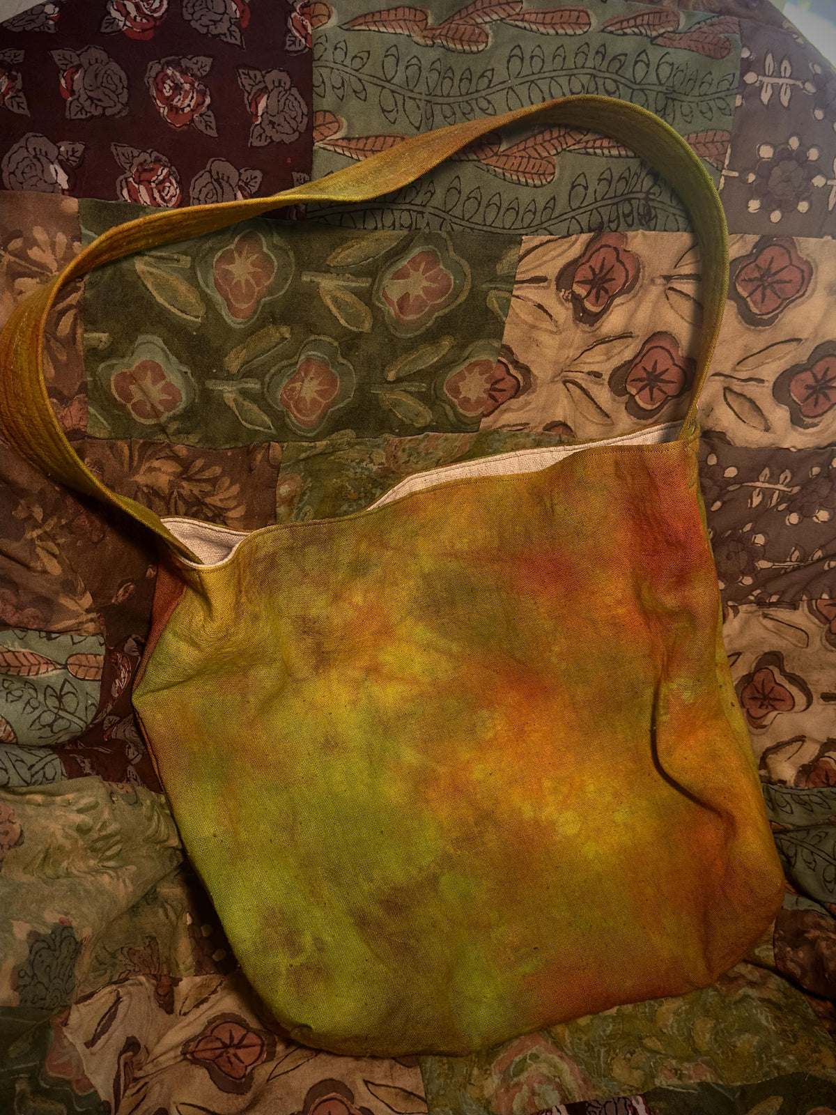 Natural plant dyed cotton shoulder bag in earthy orange olive and green tones