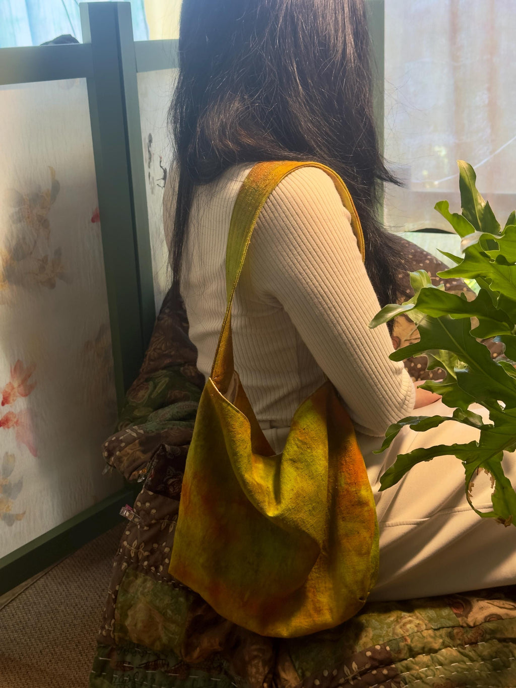 Natural plant dyed cotton shoulder bag in earthy orange olive and green tones
