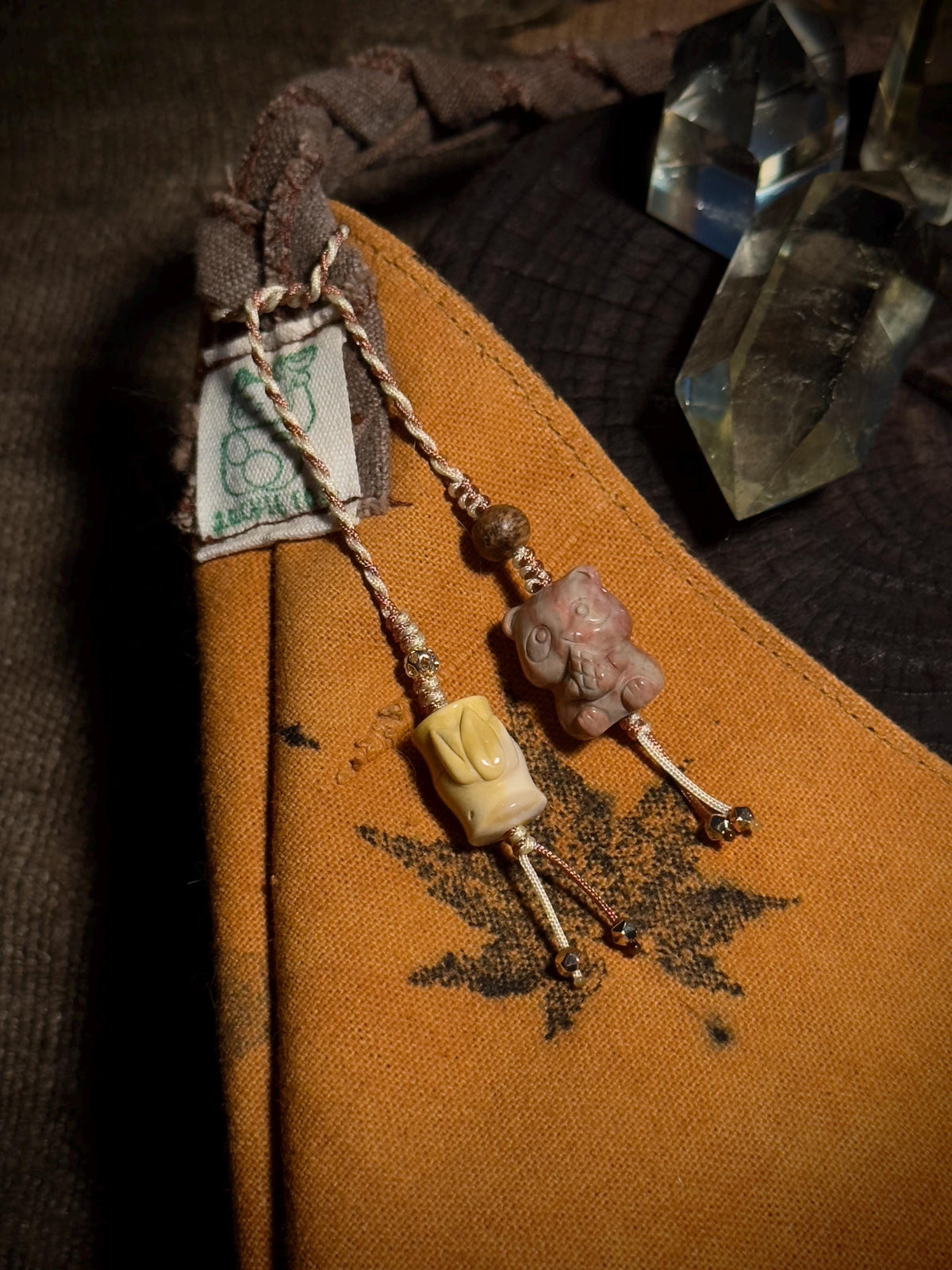 Handwoven panda Alashan agate bag charm detail