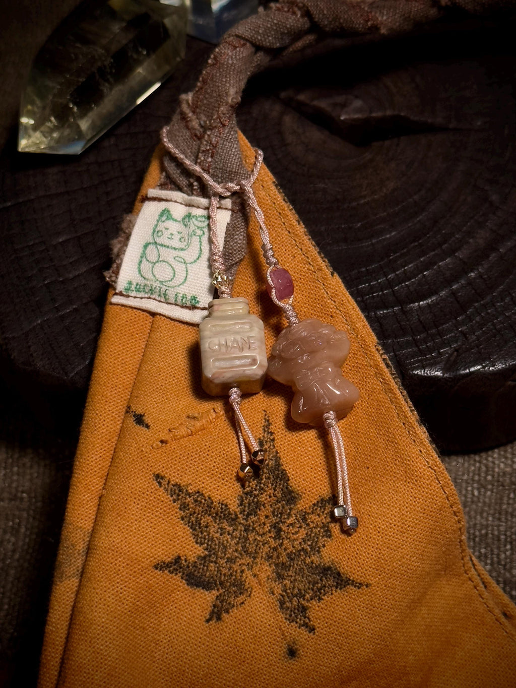 Handwoven perfume and flower Alashan agate charm detail