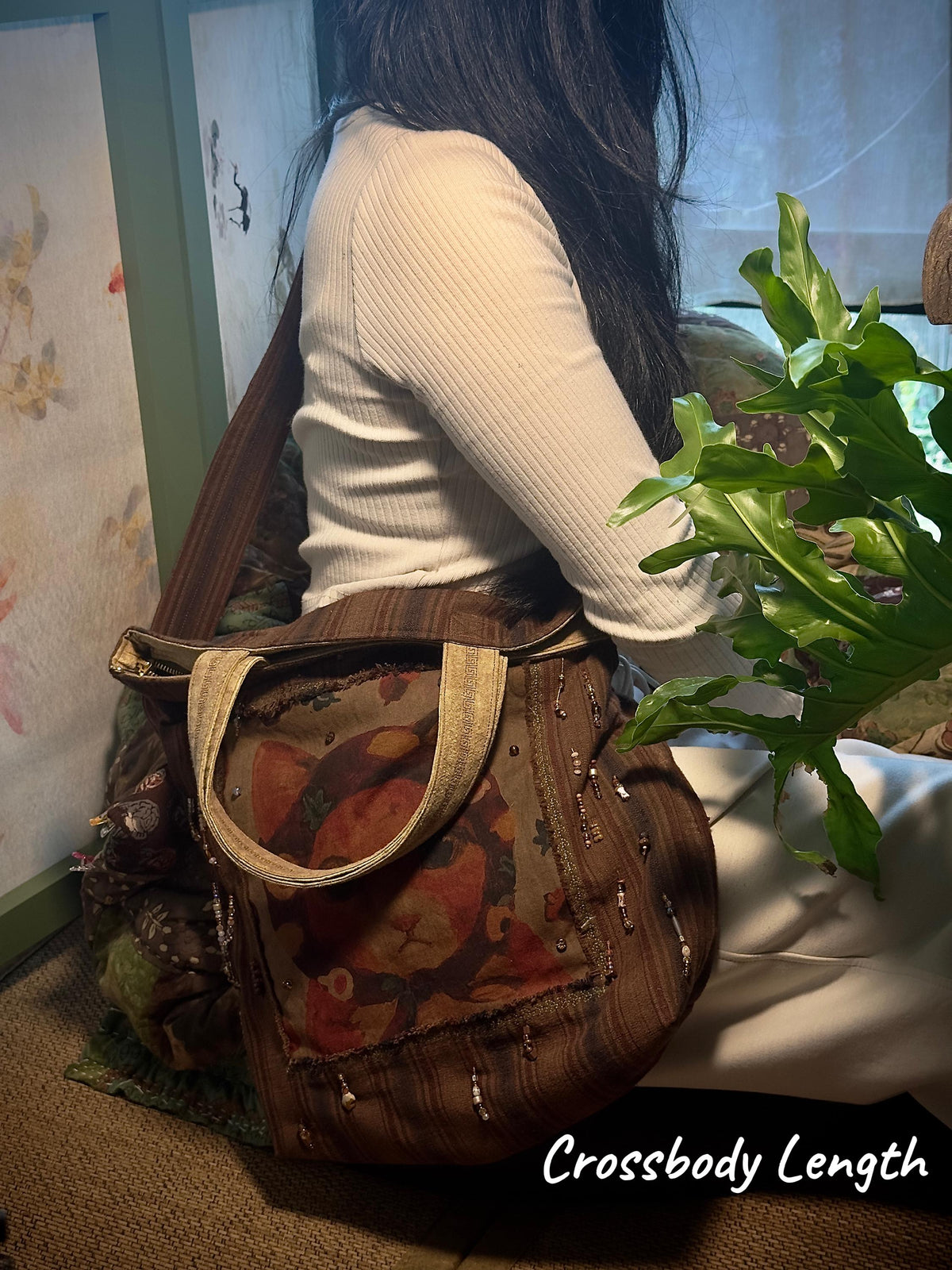 Persimmon dyed cat bag showing handwoven cotton textile and wabi-sabi details