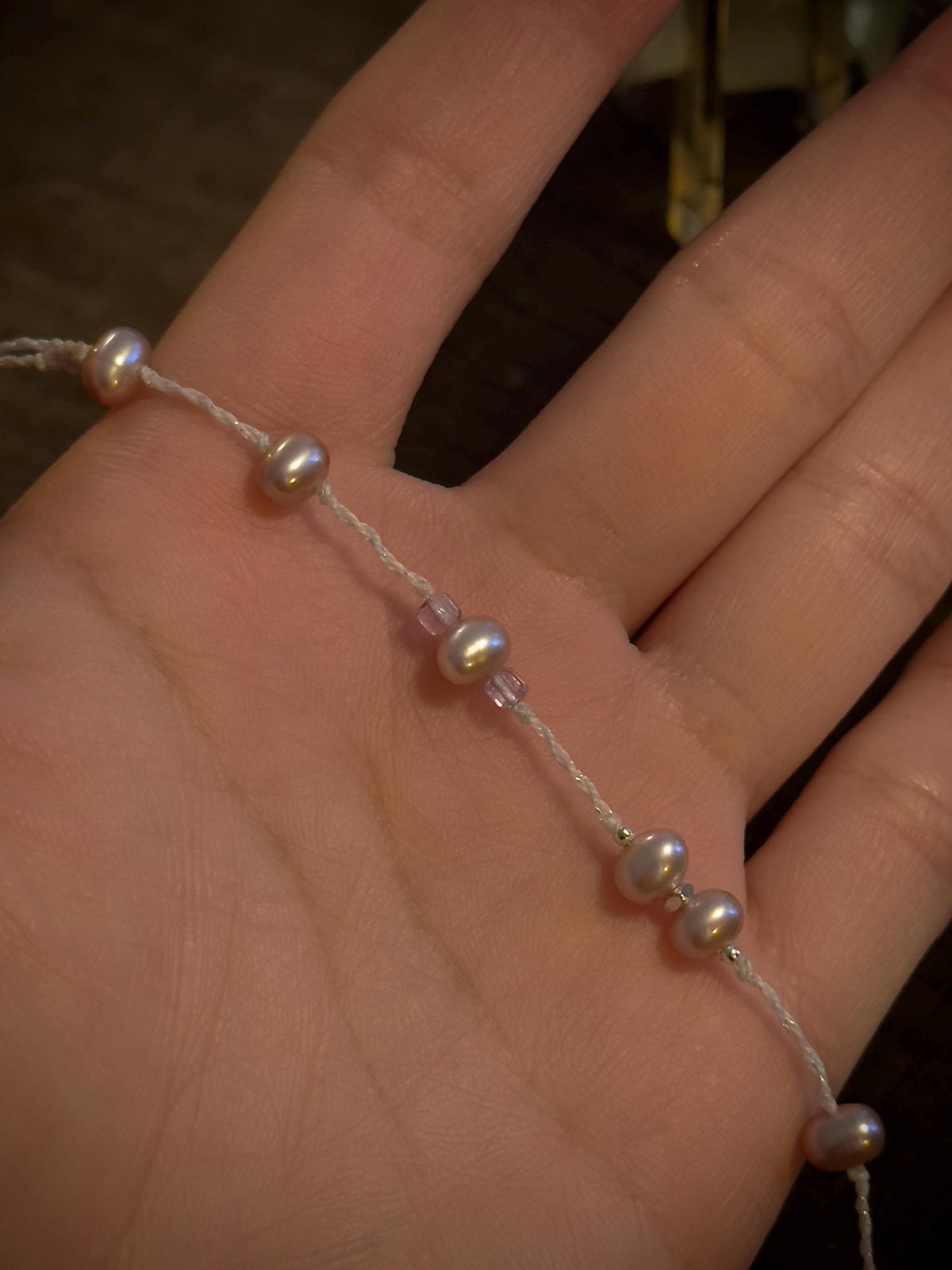 Dainty purple pearl and faceted amethyst bracelet detail