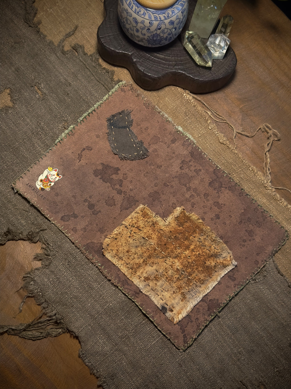 Reverse side of plant-dyed hand-stitched patchwork tea mat